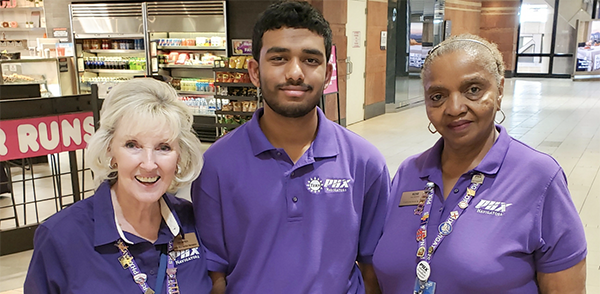 Three Navigator volunteers at Phoenix Sky Harbor